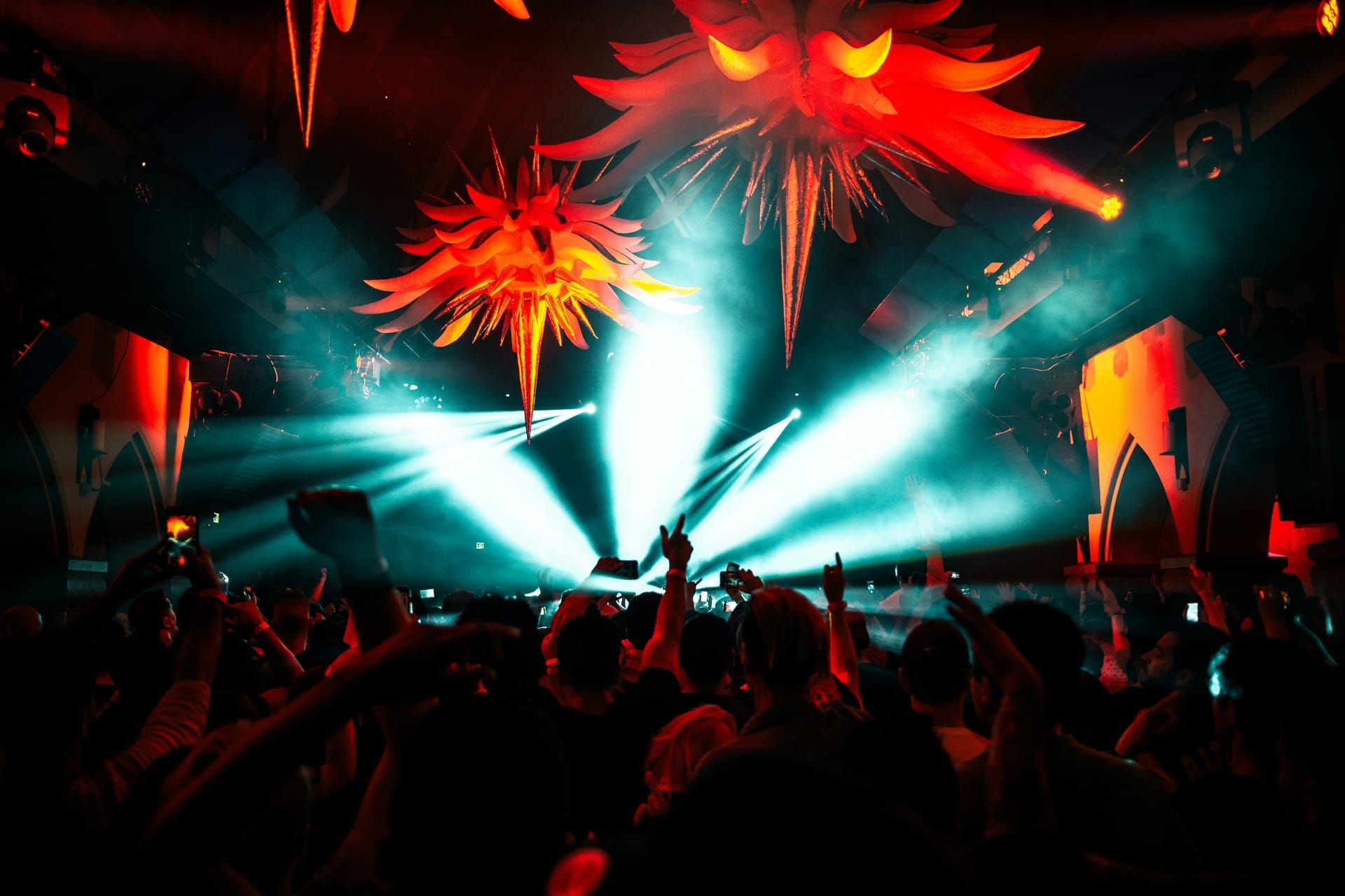 A crowd under the lights at a beach club