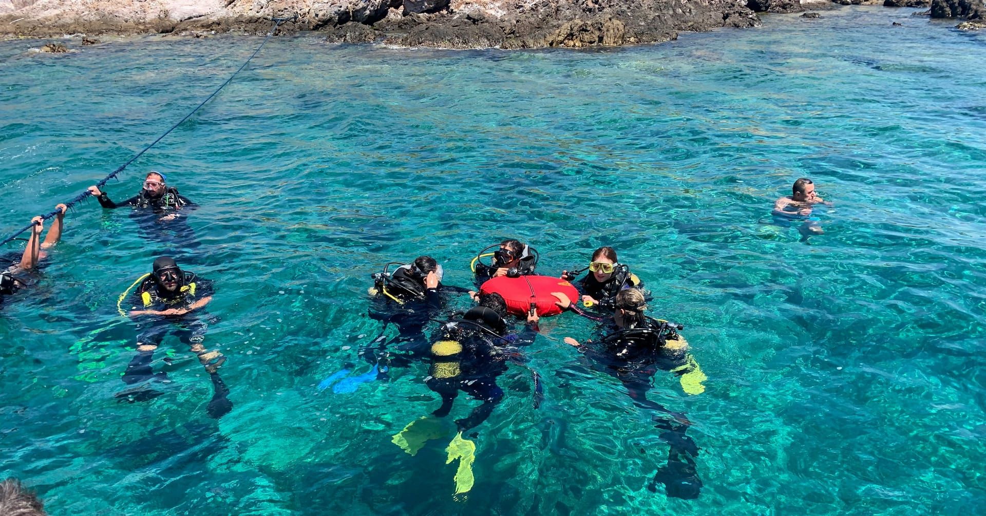 Instructors with a group of students at the surface