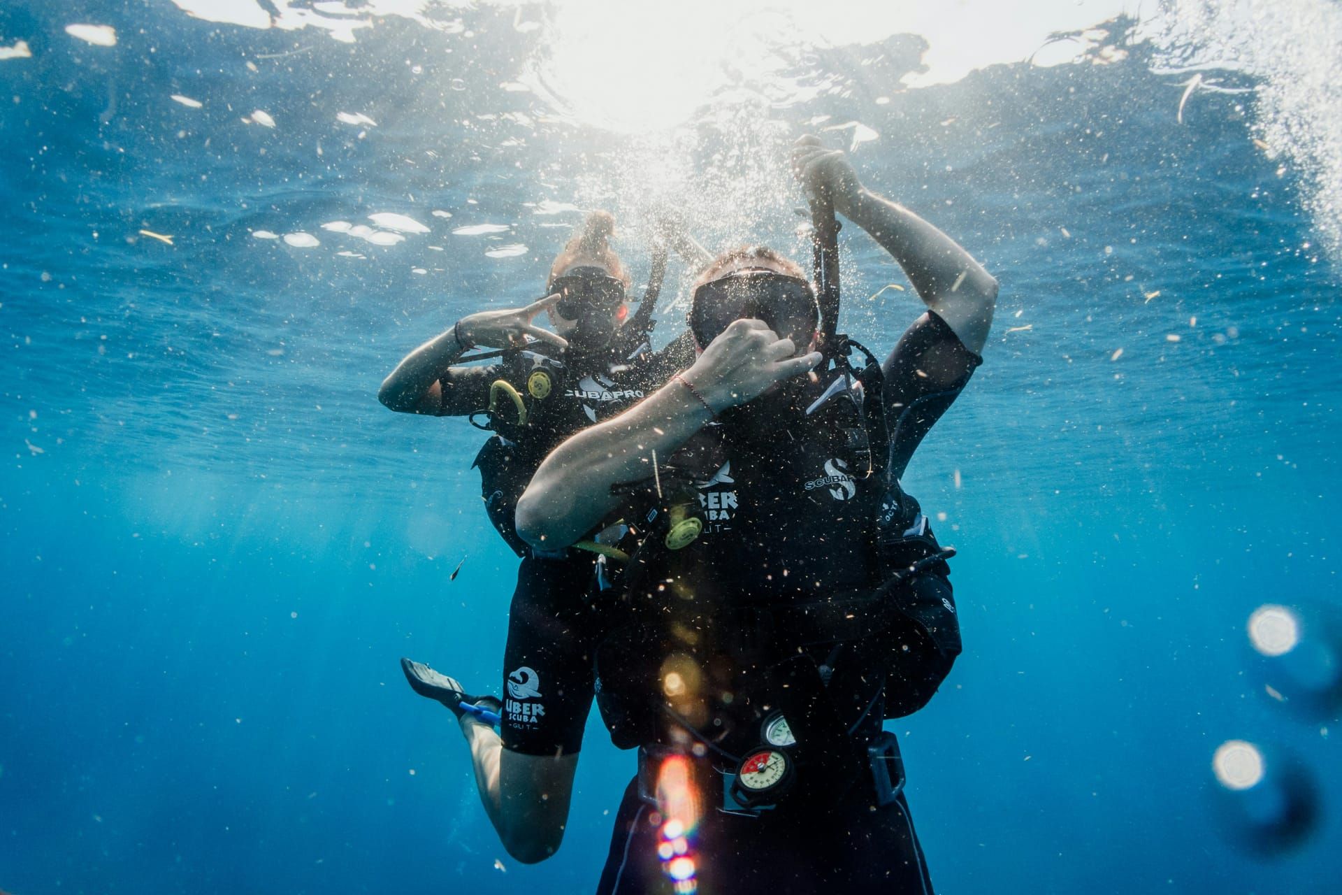 An instructor and student practising skills underwater