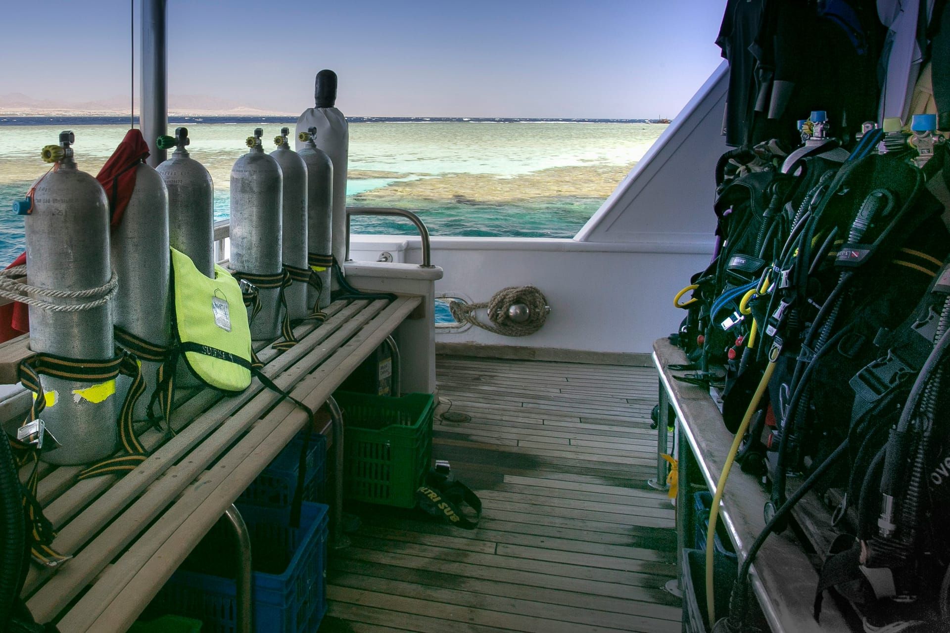 Tanks and dive gear racked on the boat